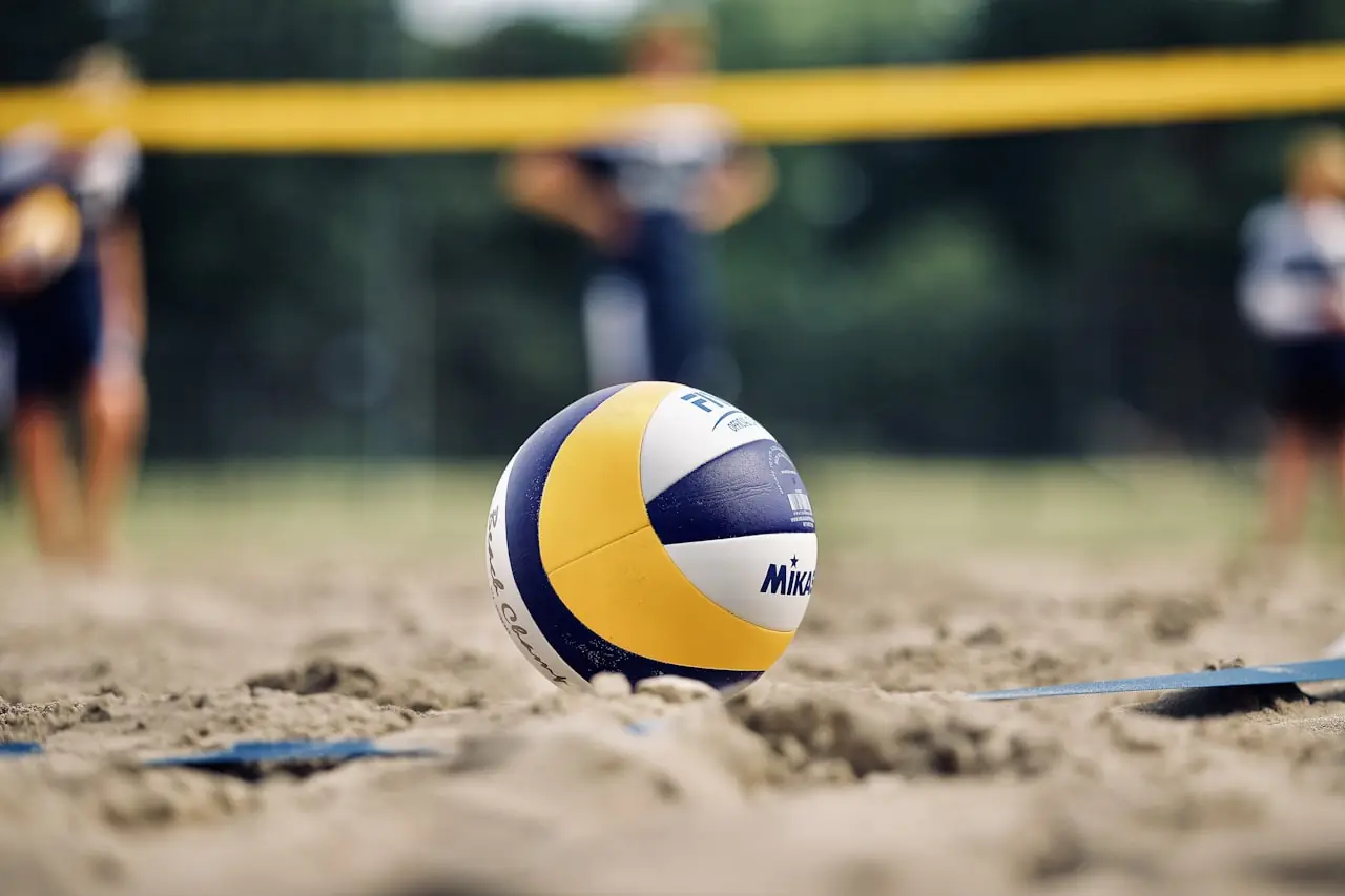 Volleyball players at the net during a match